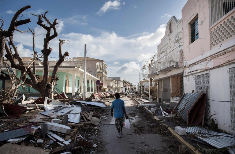 A street in St. Martin after Hurricane Irma. Residents spoke of a disintegration in law and order as survivors struggled in the face of severe food and water shortages. Credit Martin Bureau/Agence France-Presse — Getty Images